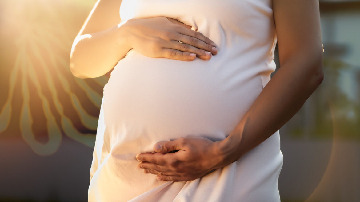 An image of a pregnant woman standing in the sunlight, with her hands gently cradling her belly. The sun's rays are highlighted to symbolize the importance of Vitamin D. In the background, there's a faint, stylized DNA strand and a glucose molecule, representing the genetic process and blood sugar regulation